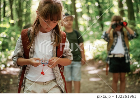 Little tourists. Kids in forest at summer daytime together Little tourists. Kids in forest at summer daytime together 132261963