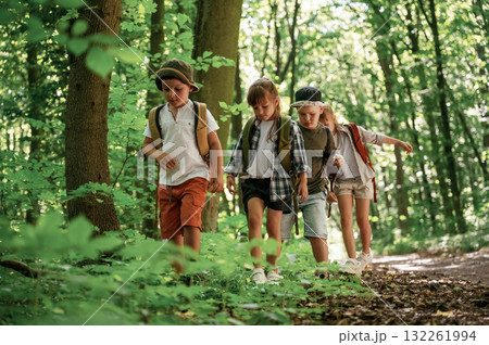 Adventure time. Kids in forest at summer daytime together 132261994