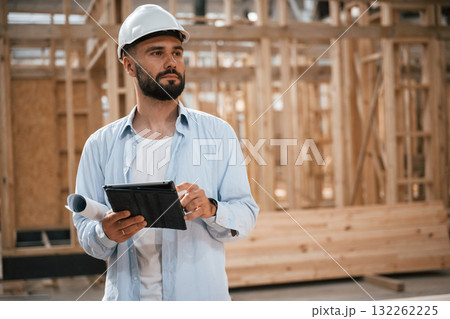 Modern manager. Industrial worker in wooden warehouse 132262225