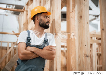 In yellow hardhat. Industrial worker in wooden warehouse 132262275