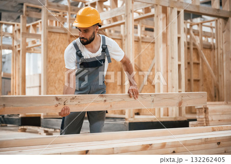 The wooden plank. Industrial worker in warehouse 132262405