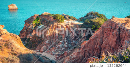Rocky seascape in the Algarve region in the Atlantic Ocean, Lagoa, Portugal, Europe. Horizontal banner 132262644