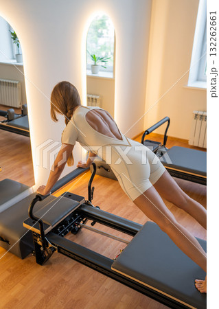 Join a Pilates session with specialized equipment and skilled instructors for great results 132262661