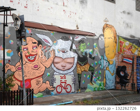 Graffiti Wall Featuring Colorful Cartoon Characters and Symbols Graffiti Wall Featuring Colorful Cartoon Characters and Symbols 132262726