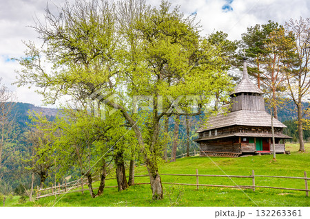 kuzhbeyi, ukraine - 12 may 2019: old wooden church on a hill in abandoned village of transcarpathia region, mizhhirya district. historic lemko architecture heritage 132263361