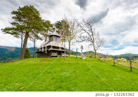 kuzhbeyi, ukraine - 12 may 2019: old wooden church on a hill in abandoned village of transcarpathia region, mizhhirya district. historic lemko architecture heritage 132263362