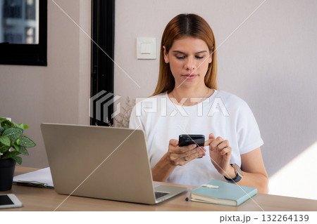 Young caucasian businesswoman texting with serious and concentration with laptop. Young caucasian businesswoman texting with serious and concentration with laptop. 132264139