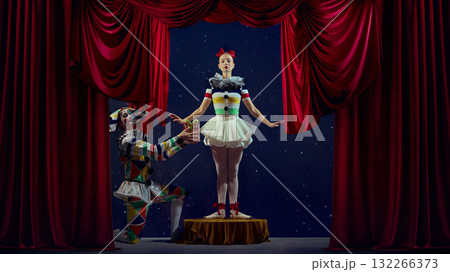 Gift of performance. Mime presenting small box to ballerina on stage. Gift of performance. Mime presenting small box to ballerina on stage. 132266373