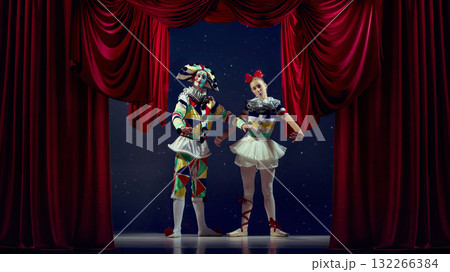 The roles we play. Mime and ballerina posing on theater stage with red curtains The roles we play. Mime and ballerina posing on theater stage with red curtains 132266384