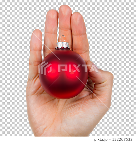 Single hand holding glossy red christmas ball ornament with metallic shine, isolated on transparent background for holiday designs 132267532
