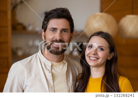 Smiling man and woman feeling excited and joyful together 132268241
