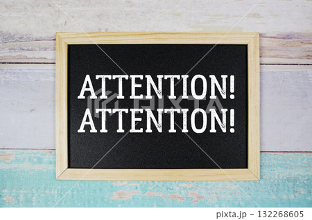 Attention! Attention! text with blackboard on wooden background 132268605