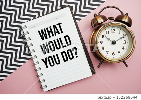 What Would You Do? text written on notepad with alarm clock 132268644