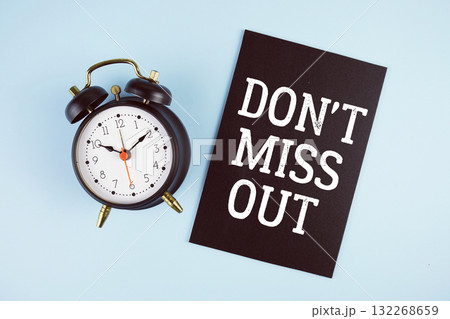 Don't Miss Out text with alarm clock on blue background 132268659