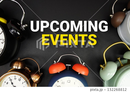 Upcoming Events text with alarm clock on black background 132268812