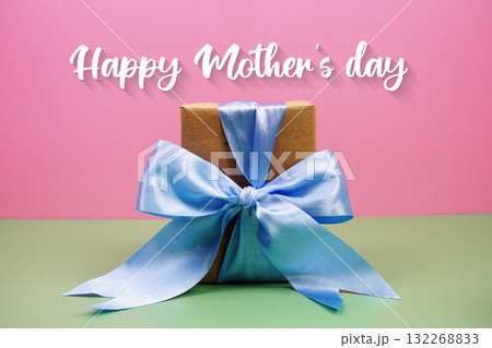 Happy Mother's Day text with gift box present on pink and green background Happy Mother's Day text with gift box present on pink and green background 132268833