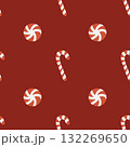 Seamless Christmas pattern with candies. Background with traditional winter sweets on a red background. Lollipops, caramels, and candy canes. Simple flat vector illustration. 132269650