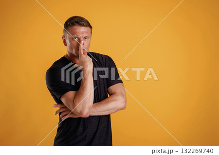 Thoughtful facial expression. Man is against background in the studio Thoughtful facial expression. Man is against background in the studio 132269740