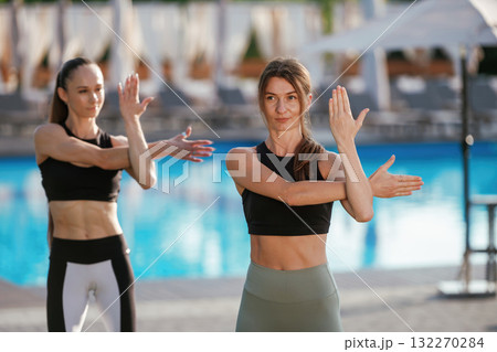 Two fitness women are together outdoors, conception of sport Two fitness women are together outdoors, conception of sport 132270284