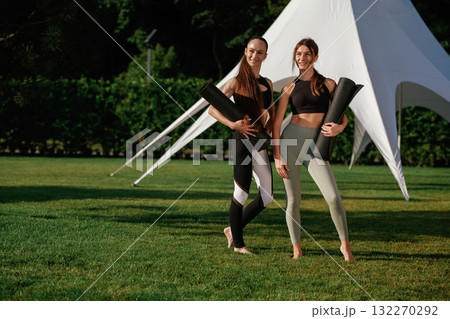 Cheerful facial expressions. Two fitness women are together outdoors, conception of sport Cheerful facial expressions. Two fitness women are together outdoors, conception of sport 132270292
