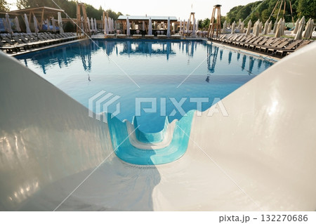 Pool slide, clean water in the vacation place, distant view 132270686