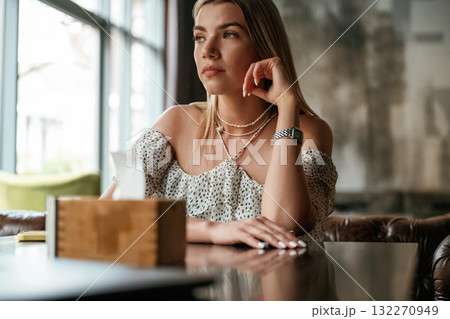 Young beautiful woman is in the restaurant 132270949