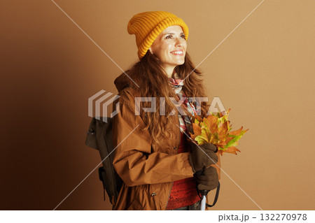 Middle-Aged Woman with Fall Leaves and Hiking Gear Middle-Aged Woman with Fall Leaves and Hiking Gear 132270978