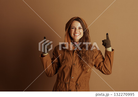Enthusiastic Woman Pointing Upwards Enthusiastic Woman Pointing Upwards 132270995