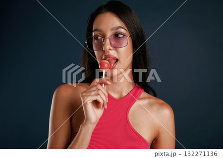 Beautiful young woman is against background 132271136
