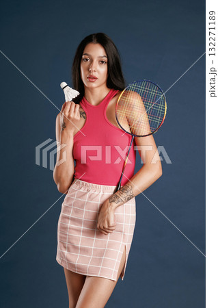 Badminton player. Beautiful young woman is against background Badminton player. Beautiful young woman is against background 132271189