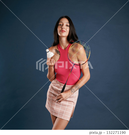 Badminton player. Beautiful young woman is against background Badminton player. Beautiful young woman is against background 132271190