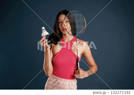 Badminton player. Beautiful young woman is against background 132271192