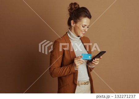 Concentrated Woman Making Mobile Payment 132271237