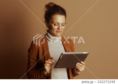 Concentrated Businesswoman Interacting with Tablet 132271249