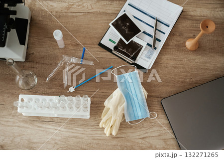 Microscope and laptop. Doctor's equipment, objects on the table Microscope and laptop. Doctor's equipment, objects on the table 132271265