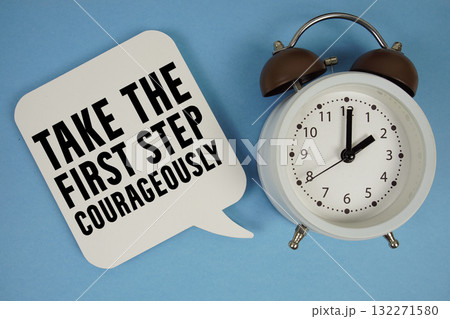 Take the first step courageously text with alarm clock on blue background 132271580
