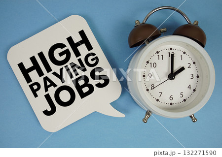 High Paying Jobs text with alarm clock on blue background High Paying Jobs text with alarm clock on blue background 132271590