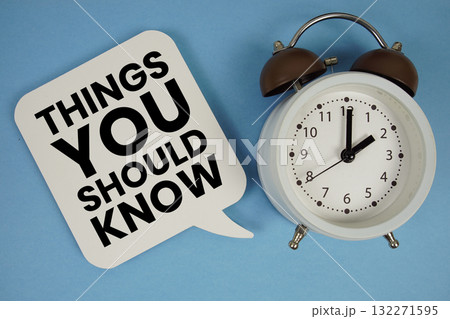 Things You Should Know text with alarm clock on blue background 132271595