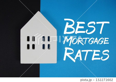 Best Mortgage Rates text with house models on blue background 132271602