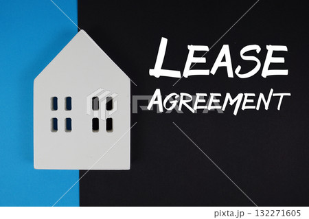 Lease Agreement text with house models on black background Lease Agreement text with house models on black background 132271605