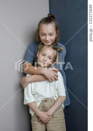 Pretty little girl and boy playing indoor. Cute children together Pretty little girl and boy playing indoor. Cute children together 132271680