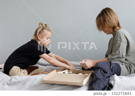 Cute children are ready to play chess at home 132271681