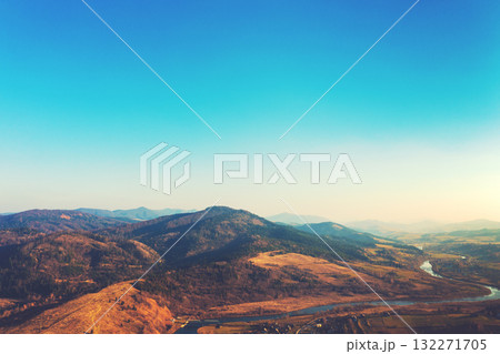 Top view of colorful mountain slopes and river Stryi on a sunny autumn day. Beautiful landscape. Carpathians, Carpathian Ruthenia, Ukraine 132271705