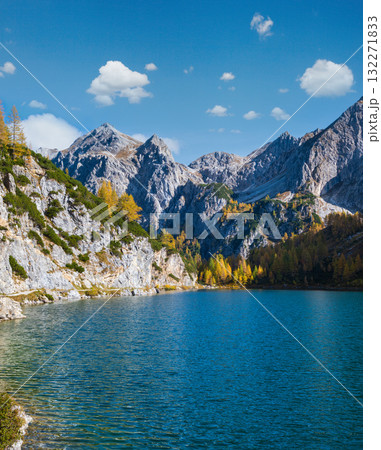 Sunny autumn alpine Tappenkarsee lake and rocky mountains above, Kleinarl, Land Salzburg, Austria. 132271833
