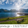 Peaceful autumn Alps mountain lake. Morning view to Traunsee lake and Traunstein mountain in far, Upper Austria. 132271917