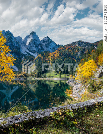 Peaceful autumn Alps mountain lake with reflections. Gosauseen or Vorderer Gosausee lake, Upper Austria. Dachstein summit and glacier in far. Peaceful autumn Alps mountain lake with reflections. Gosauseen or Vorderer Gosausee lake, Upper Austria. Dachstein summit and glacier in far. 132271919
