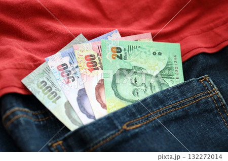Thai baht money bills in denims pocket close up. The concept of fashion and wealth 132272014