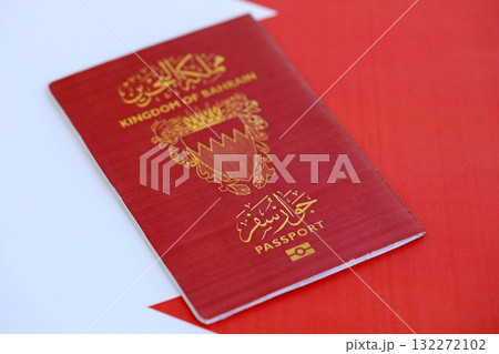 Bahraini passport on flag close up. The concept of citizenship Bahraini passport on flag close up. The concept of citizenship 132272102