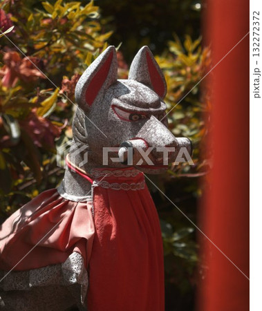 Japanese Stone fox statue with red collar 132272372