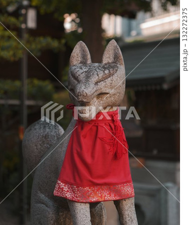 Japanese Stone fox statue with red collar Japanese Stone fox statue with red collar 132272375